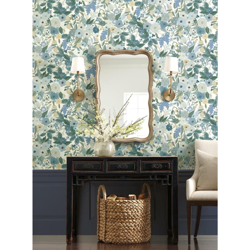 navy wainscotting, gold sconces, gold mirror, blue wallpaper, floral wallpaper